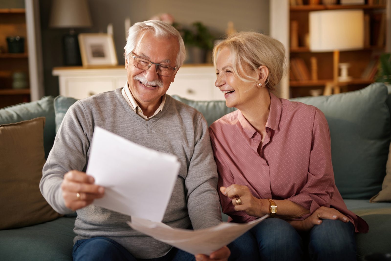A retired couple reviewing a document together at home